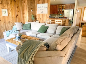 A cozy sectional to gather and enjoy the lakefront views provided by the lake