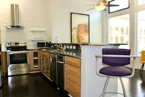 Open kitchen to living room/TV area.