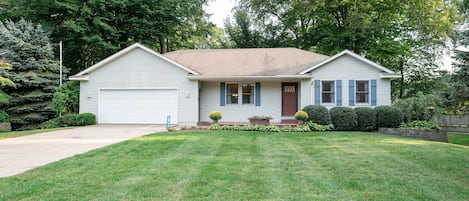 Lazy Days is a lovely four-bedroom home just a mile from Lake Michigan beach access.