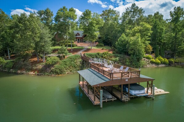 private dock, wooded lot with open grassy areas too. Boat not included.