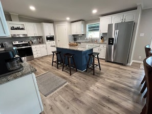 Barstools at Kitchen Island.  Great for family and friends gatherings.