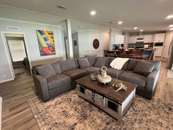 Well-appointed Large living room with sectional couch, seating for 8, and Dining table with seating for 8