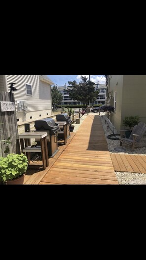 Walkway to Front Building / Parking Lot with the Grills