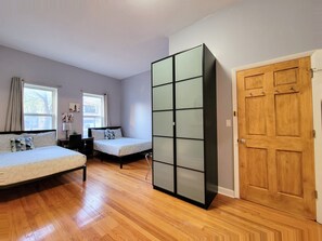 Bedroom #1 with 2 double beds and an in-suite bathroom