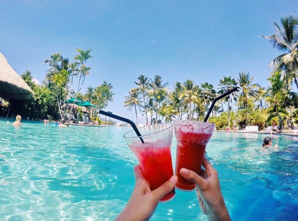 Enjoying drinks at the resort pools