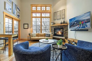 Plush seating and a vaulted ceiling provides space and comfort in the living area