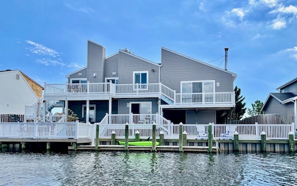 Outdoor fun in a fully fenced backyard, 72 ft waterfront & three-level deck.