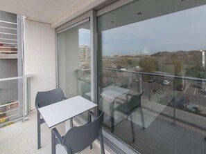 Building, Furniture, Shelf, Sky, Shade, Window, Comfort, Table, House, Chair