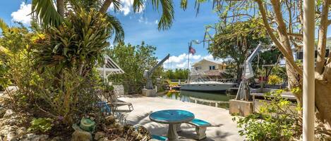 Relax and watch the kids as they enjoy some fishing from the seawall, a perfect way to create lasting memories during your stay.