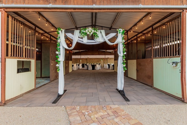 Wedding arch in barn entry