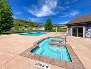 Resort-style community pool and hot tub—perfect for soaking up sun or relaxing after adventure.