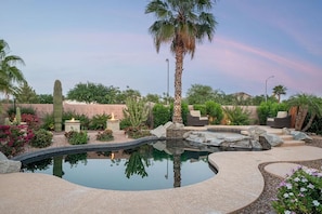 This incredible backyard seamlessly blends desert landscaping with a gorgeous pool.