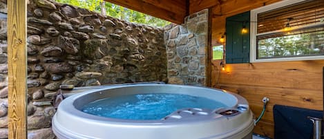 Relax in the private hot tub after a fun day in the mountains!