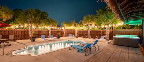 Our private backyard pool and hot tub at night!