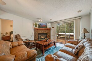 den with smart tv and gas fireplace