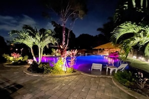Nighttime Pool glow: swim under the stars in radiant serenity