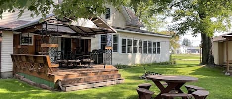 The back yard and deck. Great area for family and friends to gather around.