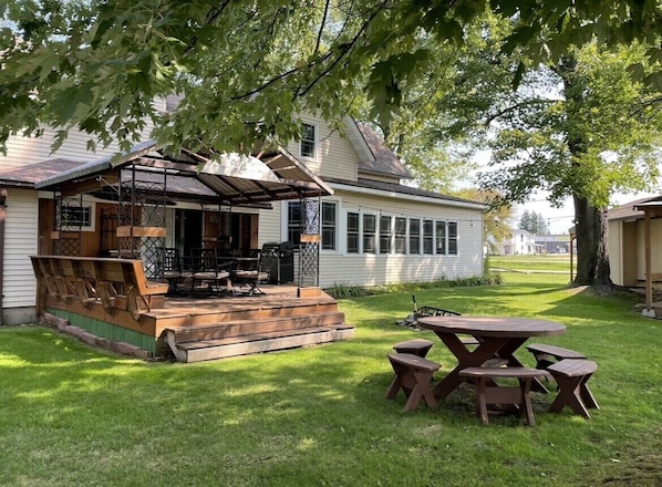 The back yard and deck. Great area for family and friends to gather around.