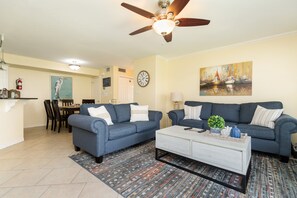 The kitchen, dining, and living areas blend together seamlessly for a bright and airy feel