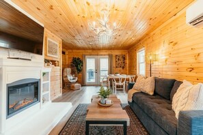 Living and dining area with electric fireplace which heats!