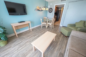 - Bright and inviting living space with comfortable seating, a flat-screen HDTV, and dining area - Perfect for unwinding, sharing meals, or catching up on your favorite shows - Open layout creates a relaxing atmosphere with a beach inspired vibe