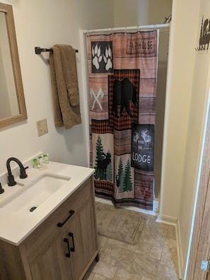 bathroom with single stall shower