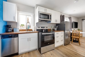 Our kitchen is fully loaded with all the amenities you need for a seamless short or long-term stay. Whether you're whipping up a quick meal or embarking on a culinary adventure, you'll find everything you need right at your fingertips.