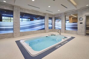 Unwind in the large jacuzzi hot tub.