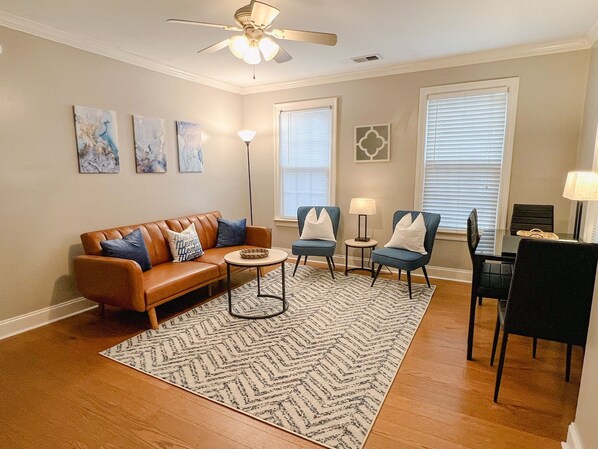 Living Room with television, futon, and dining area