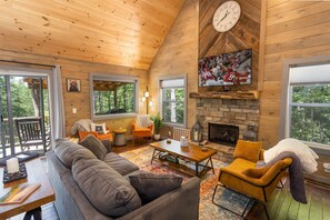 Warm Wood Interior and Gas Fire Place and Large Mounted Flat Screen TV