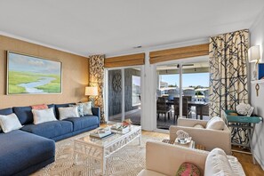 Unwind in this stunning home's living room with sliding doors