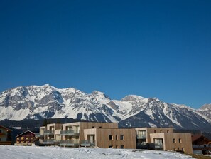 Sky, Mountain, Snow, Building, Slope, House, Cloud, Natural Landscape, Freezing, Landscape