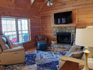 Main Level Living Room with Wood Burning Fireplace & Flat Screen TV