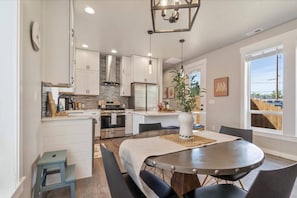 Enjoy the open living, dining, + kitchen space!