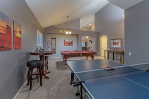 Wow! A dedicated game room with pool and ping pong tables plus board games.