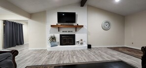 Family room, wood burning fire place.