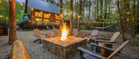 Backyard firepit, deck with slide and hammock