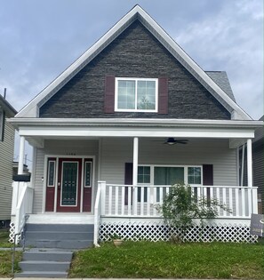 The house features a large front porch including a fan to relax outside! 