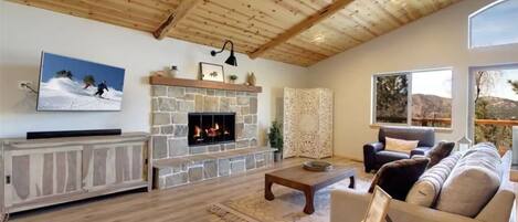 Open living room with great views, vaulted wood ceilings and relaxing decor