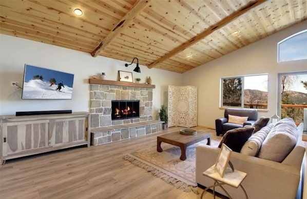 Open living room with great views, vaulted wood ceilings and relaxing decor