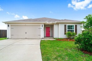 Exterior Including a 2 Car Garage & 4 Car Driveway