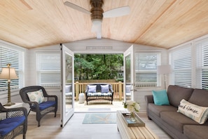 Flex Room with Deck Access and Pull-Out Couch - This breezy bonus room opens straight onto the back deck and doubles as extra sleeping space with a queen pull-out. A perfect spot for morning coffee before a stroll to Redfern Village or an afternoon nap after the beach.