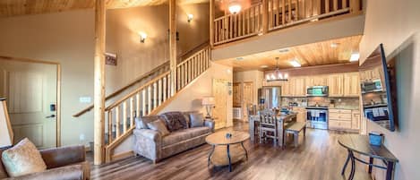 Beautiful open living room/kitchen area/loft.