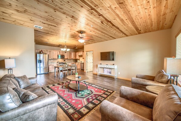 Living area with sleeper sofa, cable and smart TV.