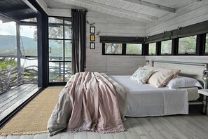 The bed is right in front of the fully screened deck, cooled by the sea breeze.