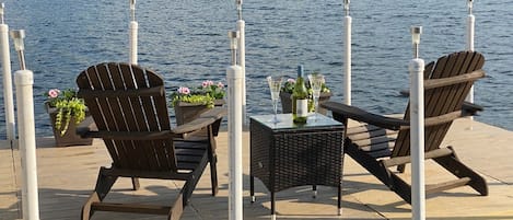 Spring, summer, and into the fall, relax with a glass of wine on the dock patio