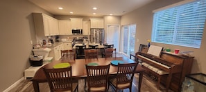 Kitchen, Dining Room, and Piano