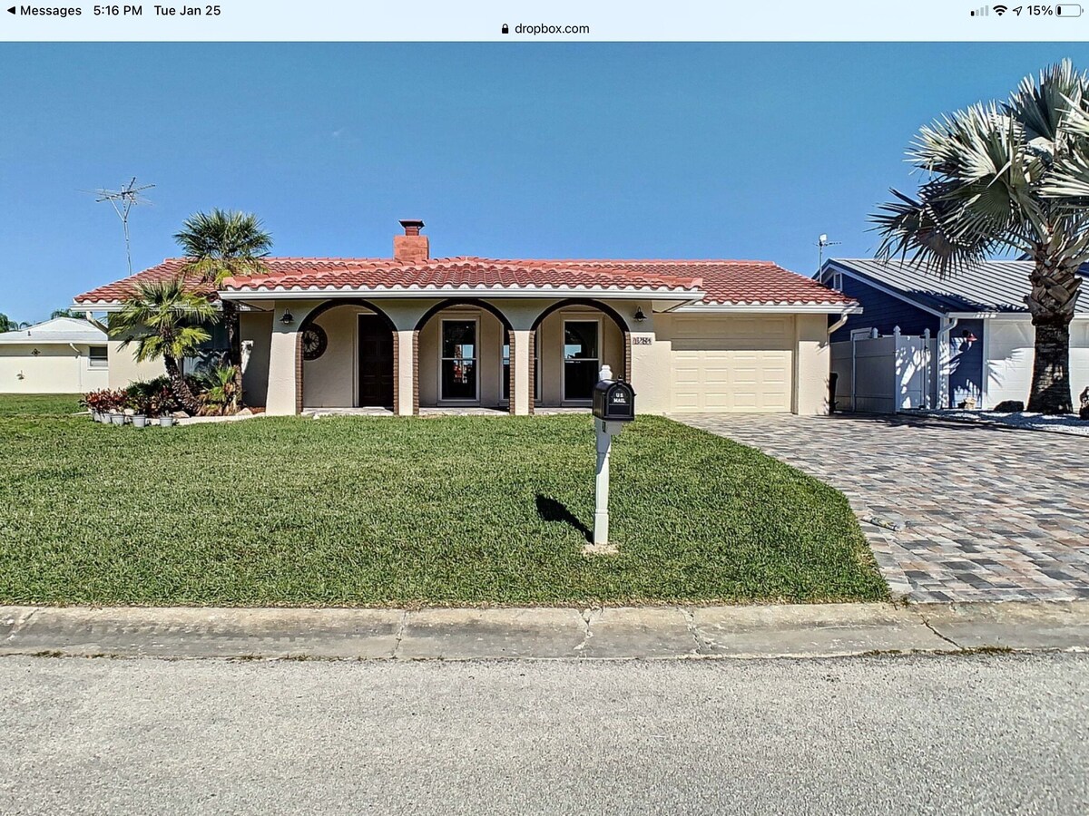 Beautiful home on a deep water canal leading to the Gulf with a boat lift.