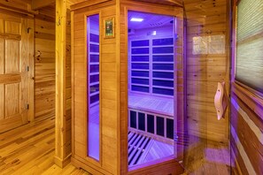Infrared wooden sauna with radio and multicolored light.