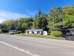 EXTERIOR: Looking at the cottage from the road.